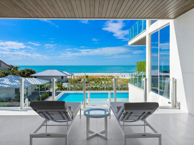 balcony featuring a water view