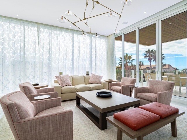 4651 Gulf Of Mexico Dr Unit 402, Longboat Key, FL 34228 - sunroom featuring a chandelier