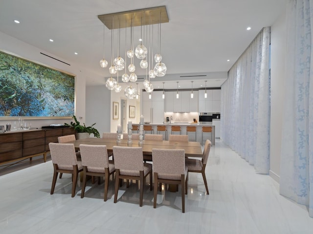 dining area with an inviting chandelier