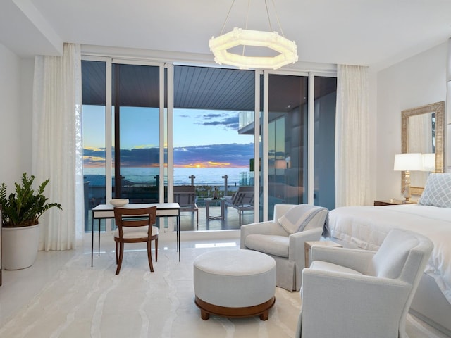 4651 Gulf Of Mexico Dr Unit 402, Longboat Key, FL 34228 - bedroom with floor to ceiling windows, a water view, and access to outside