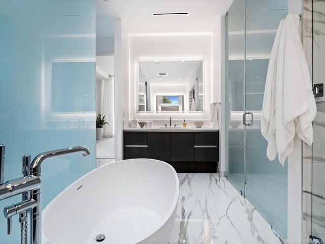 4651 Gulf Of Mexico Dr Unit 402, Longboat Key, FL 34228 - bathroom featuring a shower stall, a soaking tub, and vanity