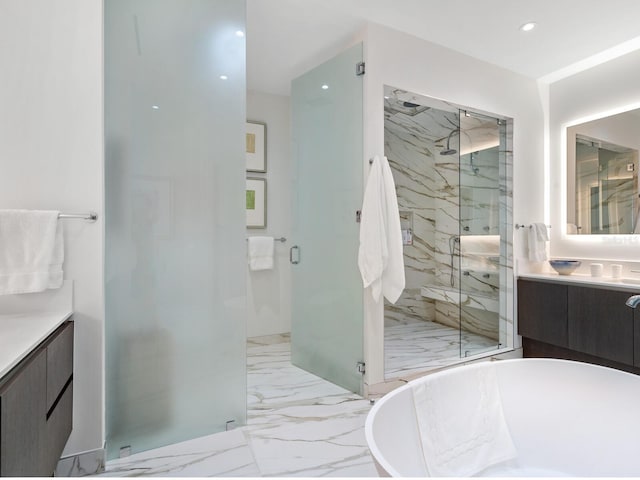 4651 Gulf Of Mexico Dr Unit 402, Longboat Key, FL 34228 - bathroom with vanity, a marble finish shower, marble finish flooring, a soaking tub, and recessed lighting
