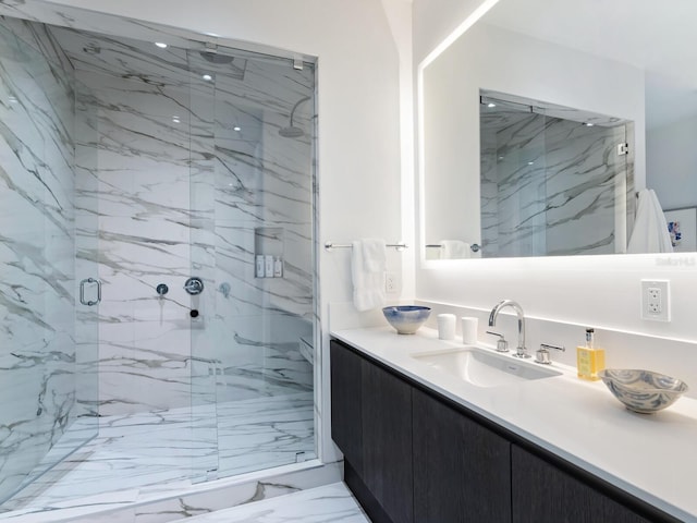 4651 Gulf Of Mexico Dr Unit 402, Longboat Key, FL 34228 - bathroom featuring a stall shower, marble look tile flooring, and vanity