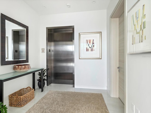 4651 Gulf Of Mexico Dr Unit 402, Longboat Key, FL 34228 - corridor featuring elevator and light tile patterned floors