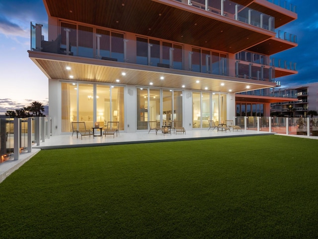 4651 Gulf Of Mexico Dr Unit 402, Longboat Key, FL 34228 - back of house featuring a balcony and a patio area