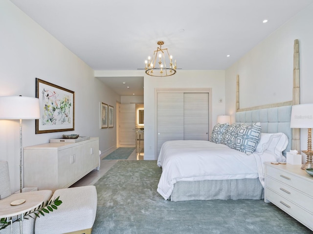 bedroom with a chandelier and dark carpet