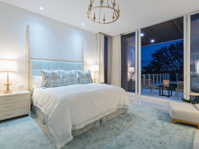 bedroom with access to outside, light colored carpet, and a notable chandelier