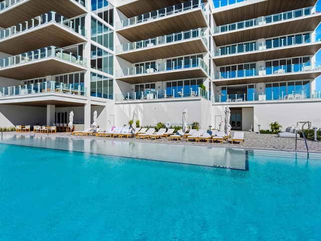 view of swimming pool featuring a water view