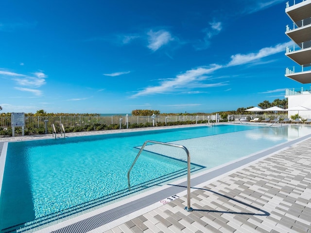 4651 Gulf Of Mexico Dr Unit 402, Longboat Key, FL 34228 - community pool featuring fence