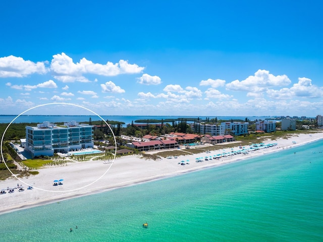 drone / aerial view with a view of the beach and a water view