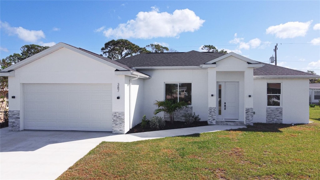 ranch-style house featuring a front yard and a garage