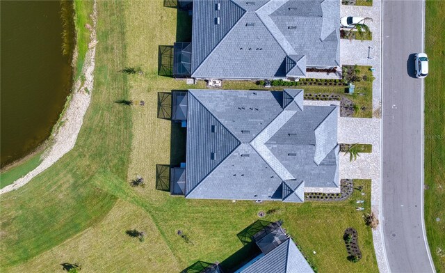 drone / aerial view with a water view