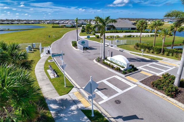 birds eye view of property featuring a water view and a residential view