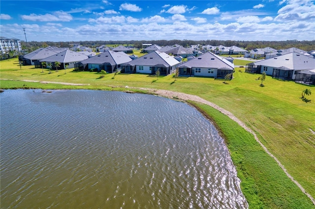 bird's eye view with a residential view and a water view