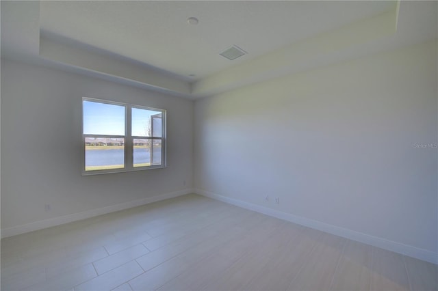 empty room featuring baseboards