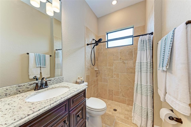 bathroom with vanity, a shower with curtain, and toilet