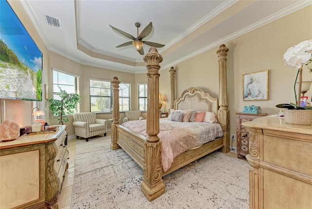 bedroom featuring ceiling fan, crown molding, and a raised ceiling