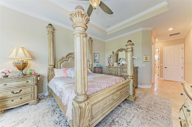 bedroom featuring crown molding, a tray ceiling, and ceiling fan