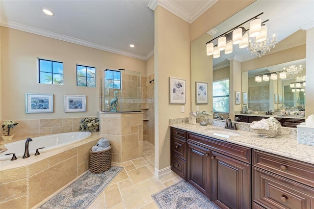 bathroom with vanity, a notable chandelier, ornamental molding, and plus walk in shower