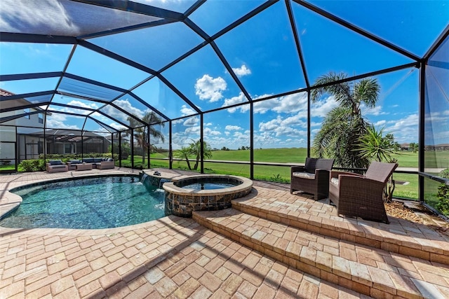 view of swimming pool featuring a patio area, a lanai, and an in ground hot tub