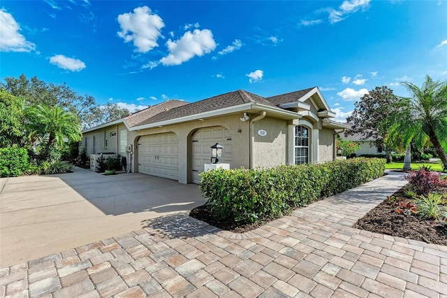 view of side of property with a garage