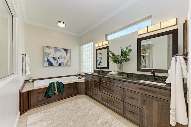 bathroom with a tub, crown molding, tile patterned flooring, and vanity