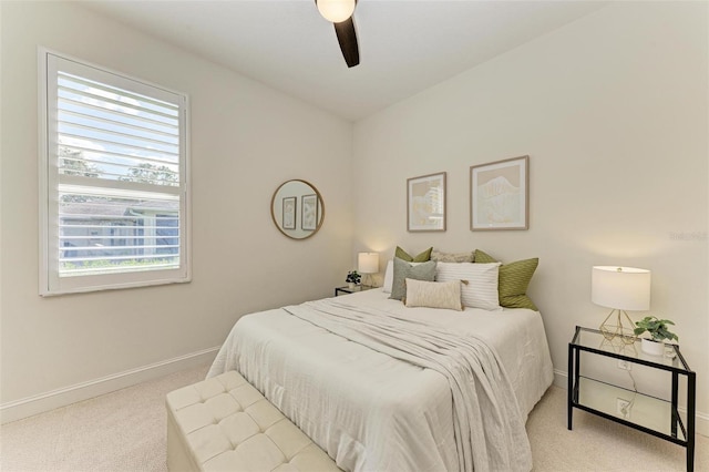 bedroom featuring ceiling fan and light colored carpet