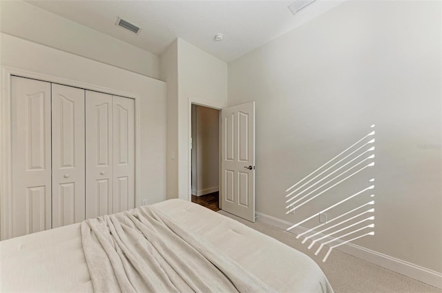 bedroom with carpet floors and a closet