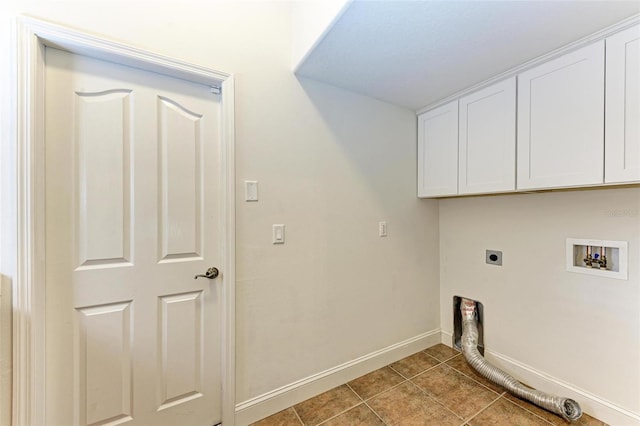 laundry room with hookup for an electric dryer, cabinets, tile patterned floors, and washer hookup