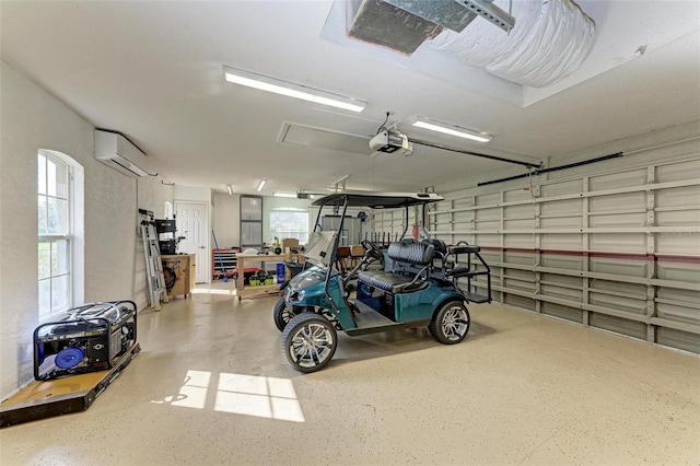 garage with a garage door opener and a wall unit AC