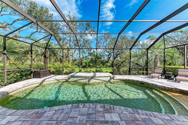 view of pool featuring a lanai and a patio area