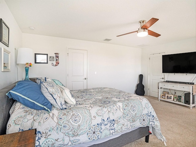 carpeted bedroom featuring ceiling fan