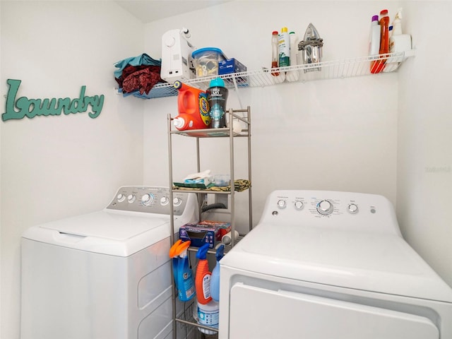 washroom featuring washing machine and clothes dryer