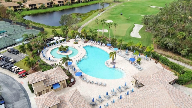 view of pool featuring a water view and a patio