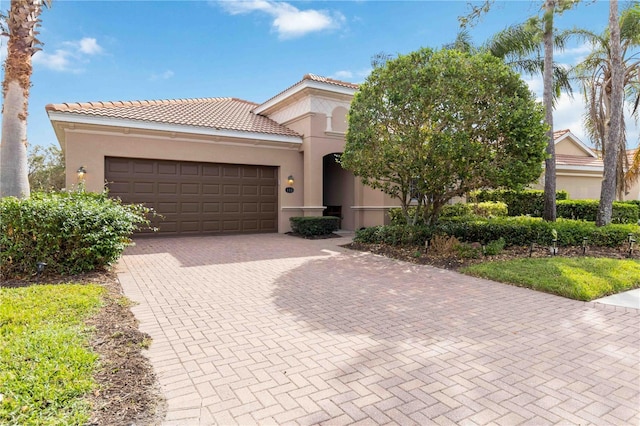 mediterranean / spanish house featuring a garage