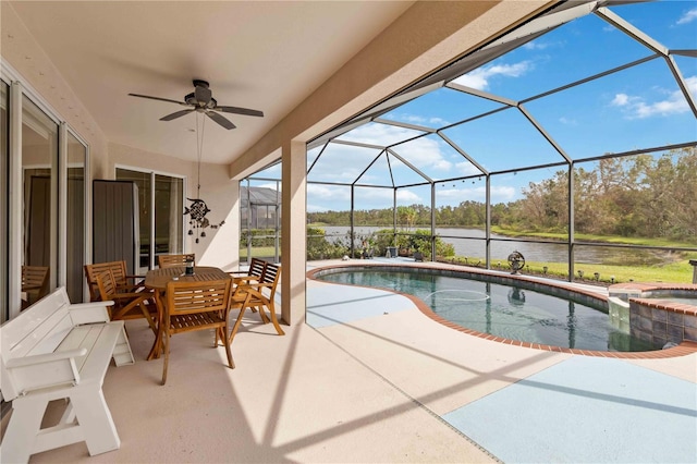 view of swimming pool featuring glass enclosure, an in ground hot tub, a water view, and a patio