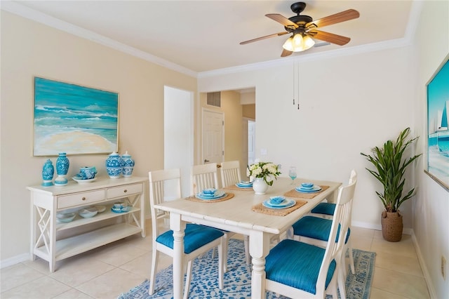 dining area with ceiling fan, ornamental molding, and light tile patterned flooring