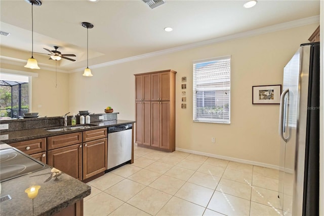 kitchen featuring ceiling fan, pendant lighting, sink, appliances with stainless steel finishes, and light tile patterned floors