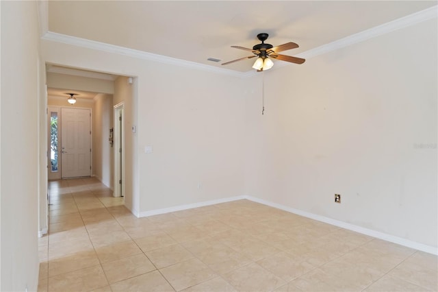 tiled spare room featuring ceiling fan and crown molding