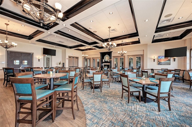 dining room with hardwood / wood-style floors, beam ceiling, and coffered ceiling