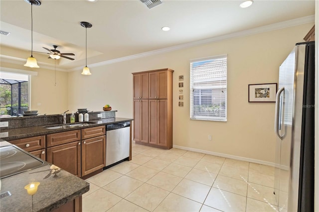 115 Winding River Trl, Bradenton, FL 34212 - kitchen with appliances with stainless steel finishes, a sink, healthy amount of natural light, ceiling fan, and crown molding