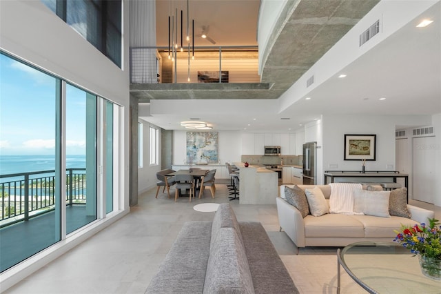 living room featuring a water view