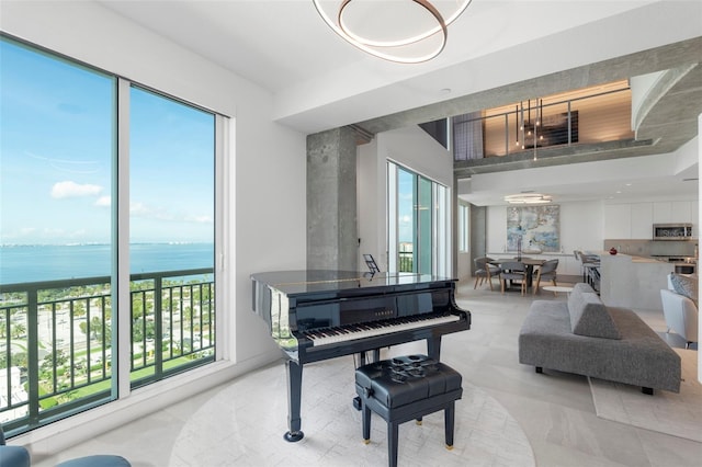 miscellaneous room with a wealth of natural light and a water view