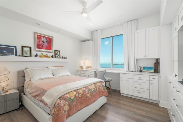 bedroom with wood-type flooring and ceiling fan