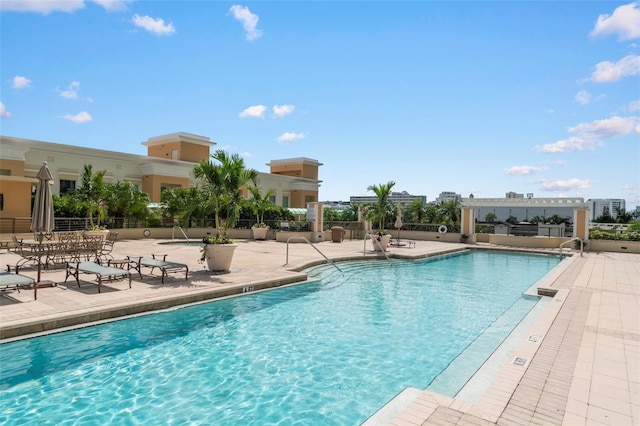 view of swimming pool featuring a patio area