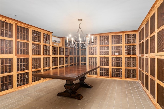 wine room with a wall unit AC, an inviting chandelier, and tile patterned flooring