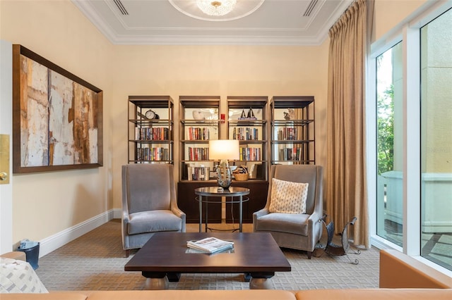 sitting room featuring crown molding