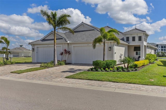 view of front facade featuring a front yard and a garage