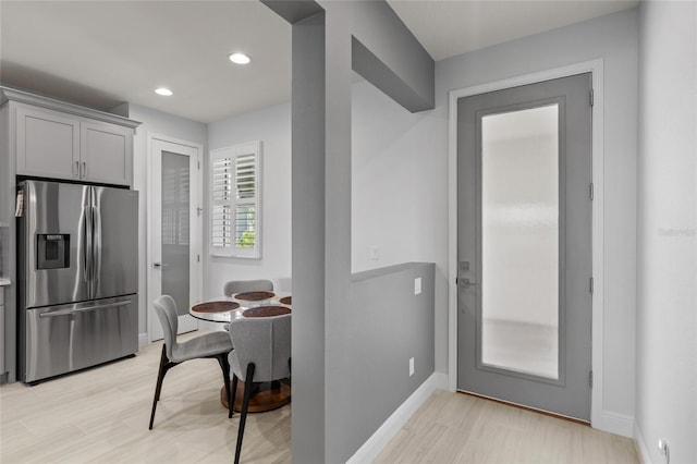 kitchen featuring light hardwood / wood-style floors and stainless steel fridge