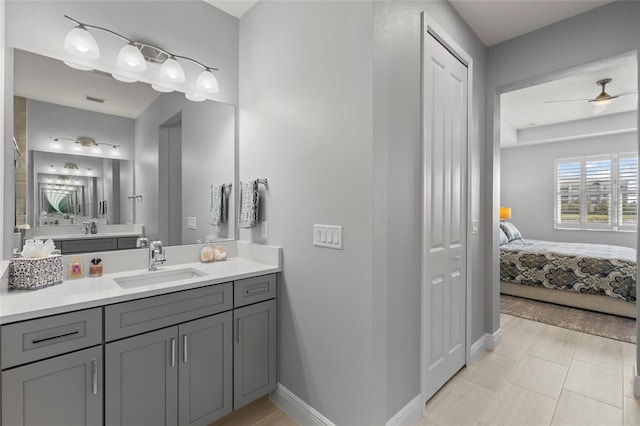 bathroom featuring vanity, tile patterned flooring, and ceiling fan